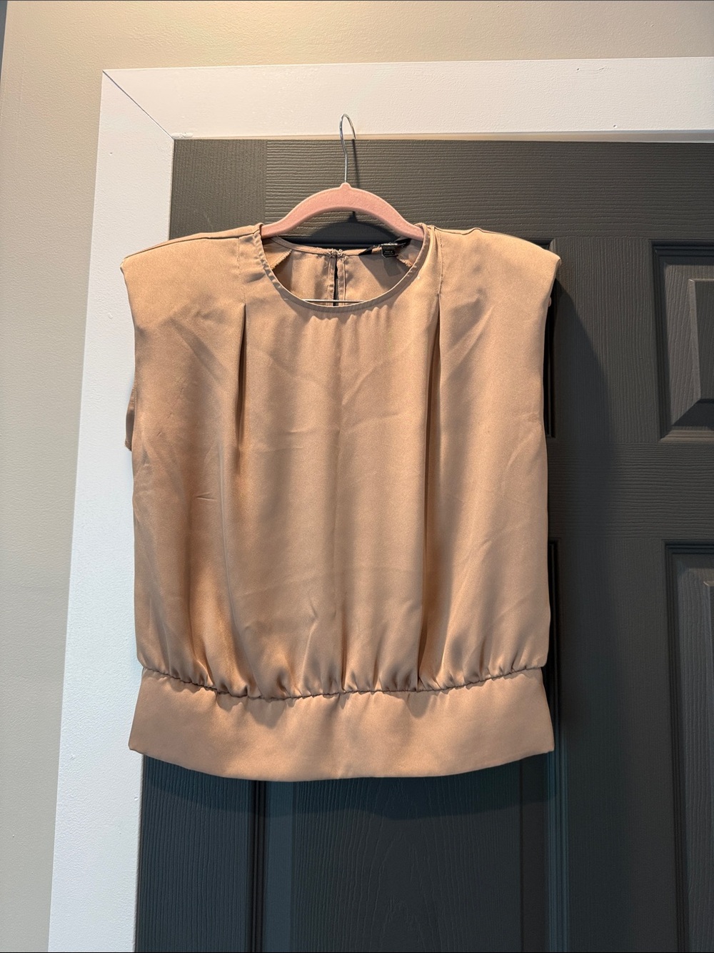Gold sleeveless blouse